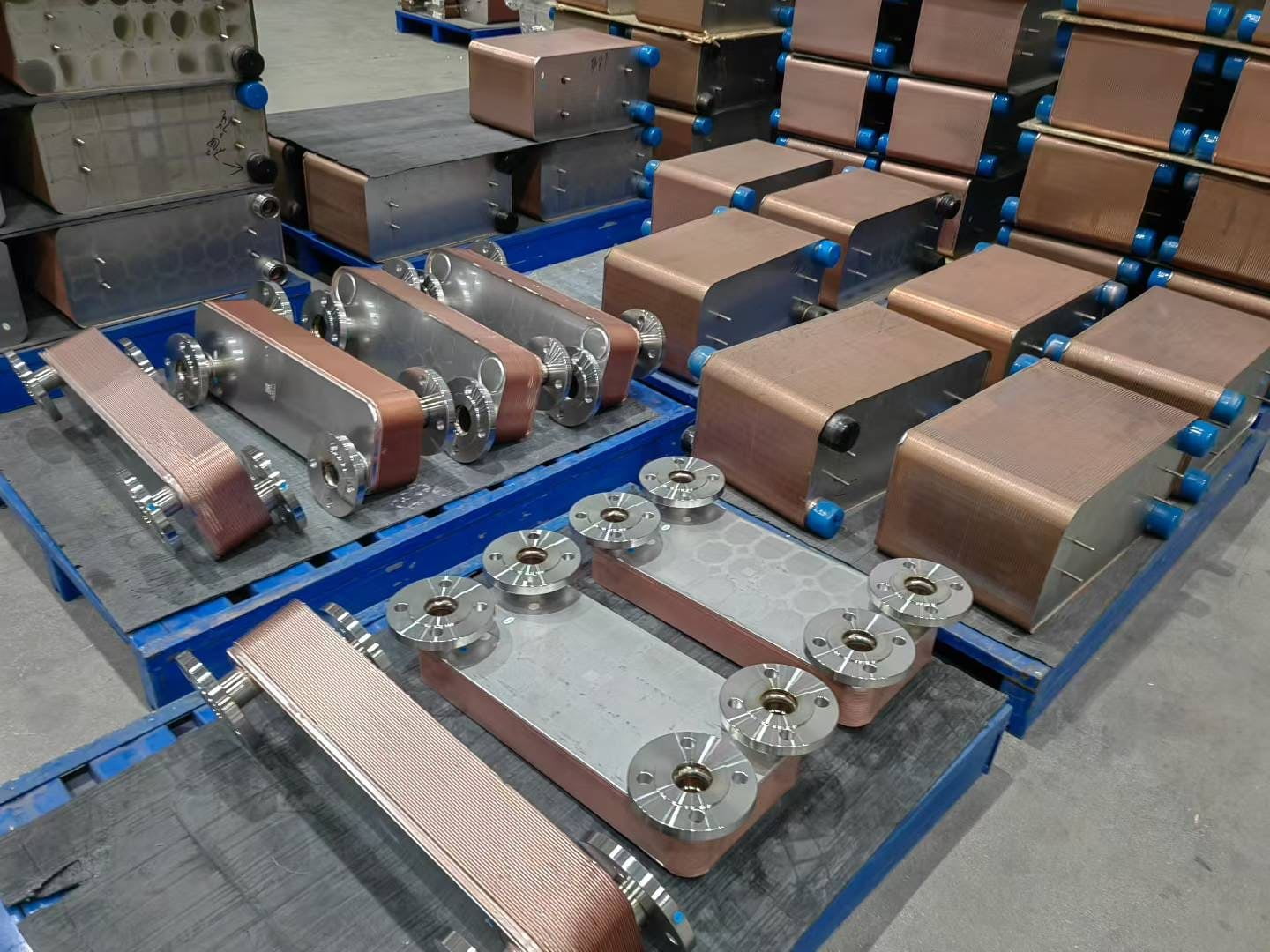 A technician opening a large gasketed plate heat exchanger